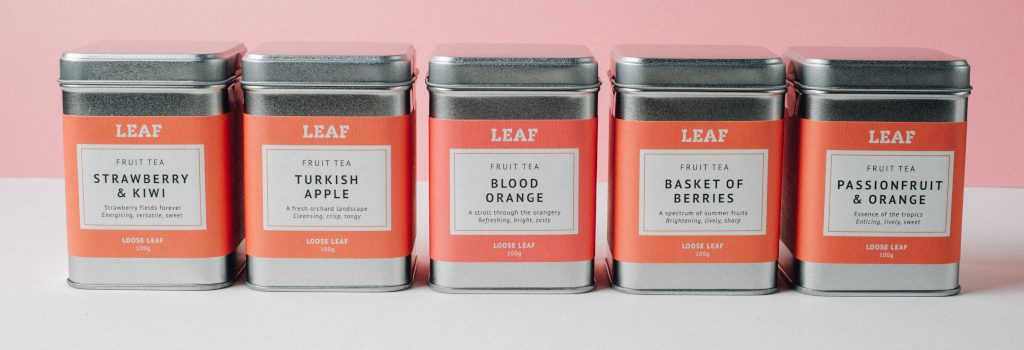 A range of loose leaf fruit tea tins