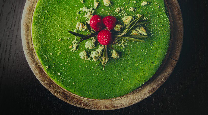 Matcha Cake Recipe Feature Image with raspberries on top