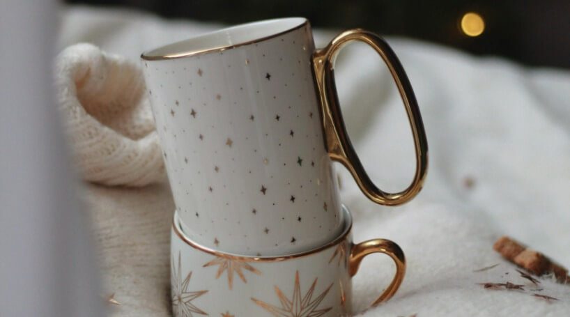 Stacked Christmas mugs.